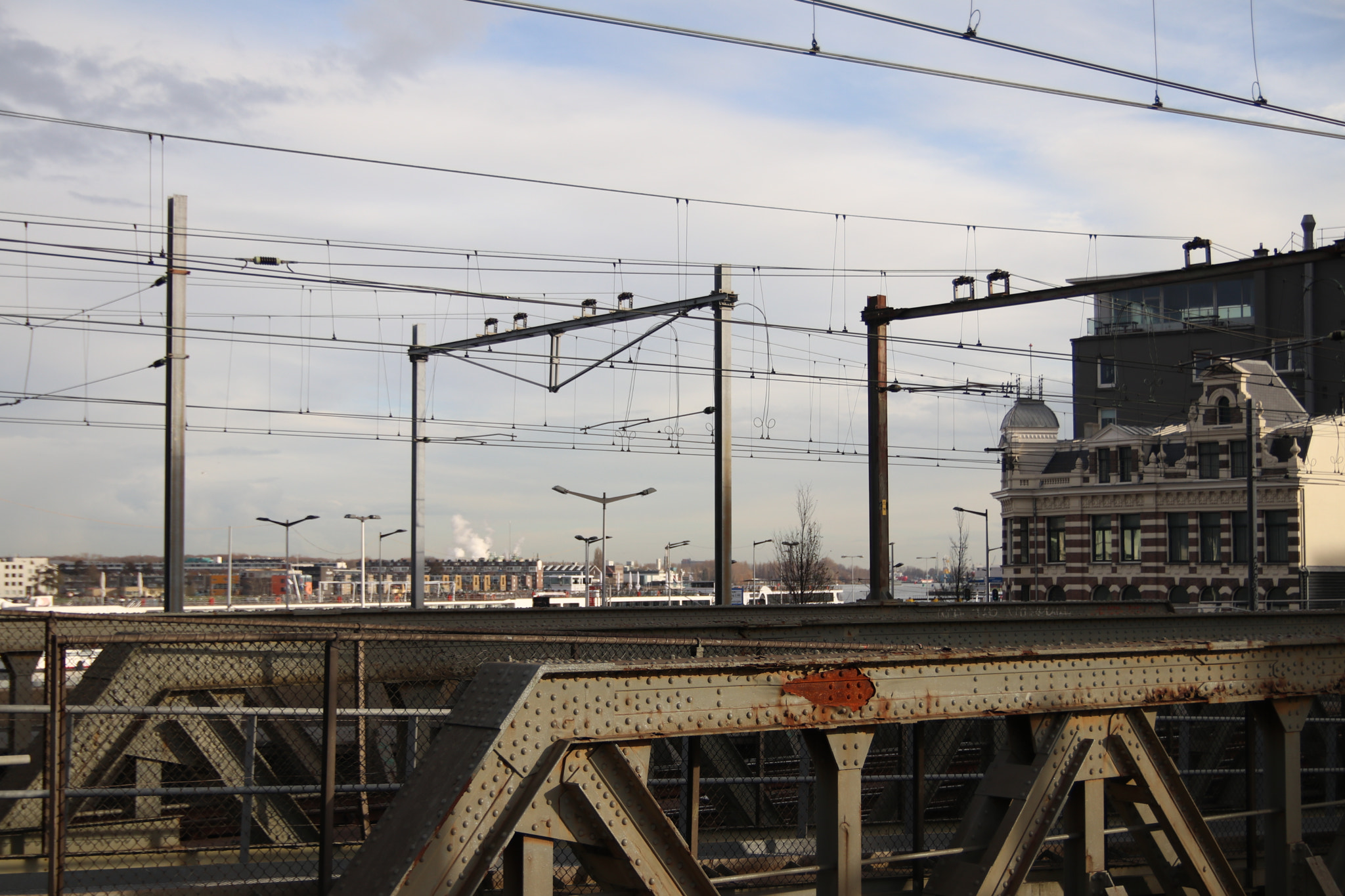 Sigma 18-50mm f/2.8 Macro sample photo. Amsterdam central  station - train bridge photography