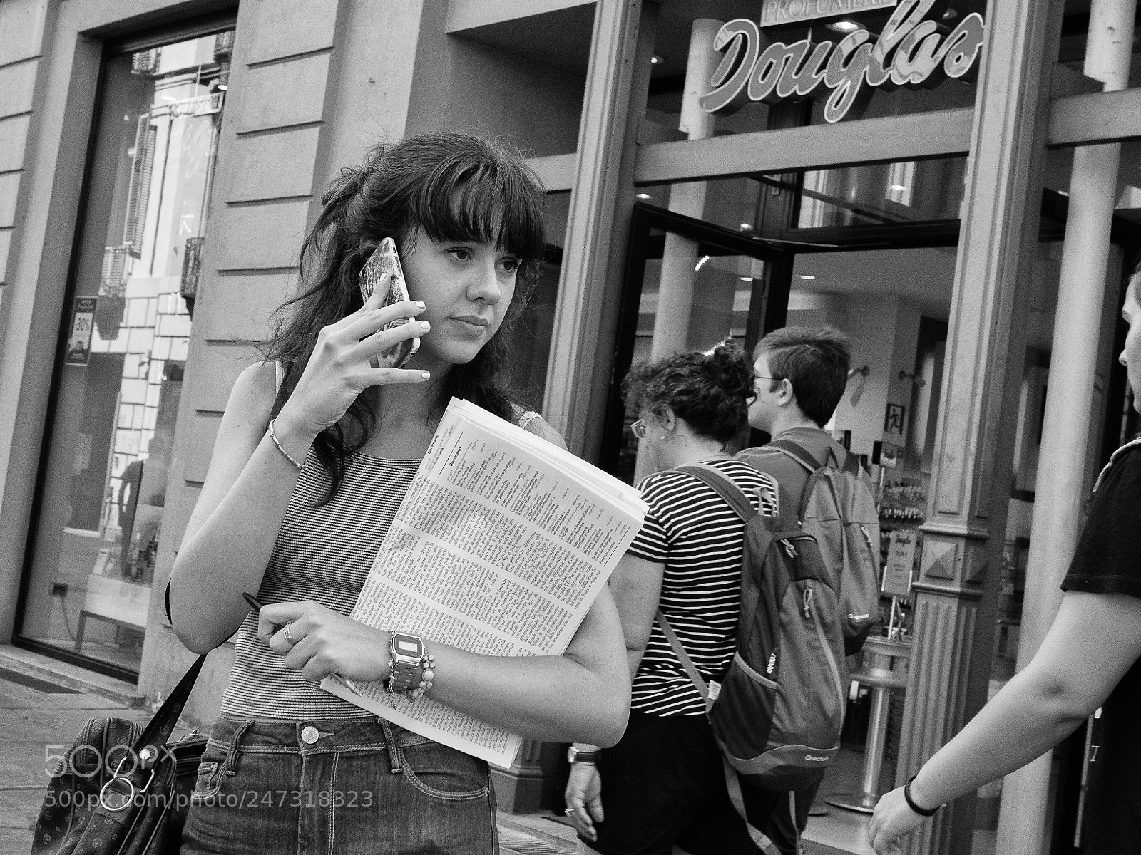 Olympus OM-D E-M5 sample photo. Trying to sell newspapers photography