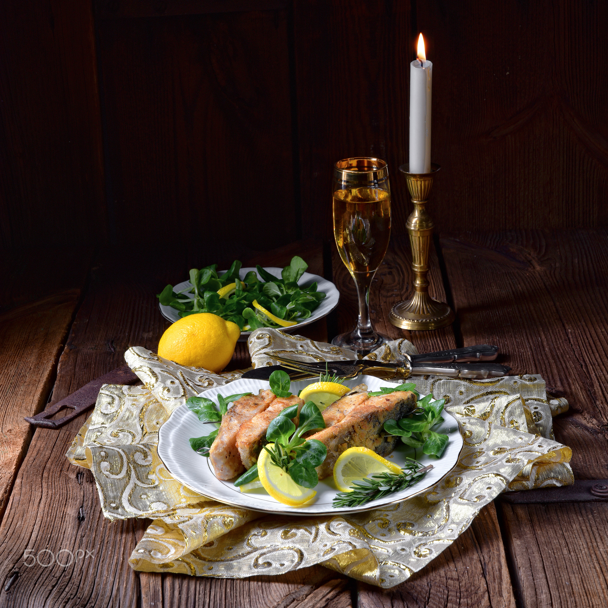 Fried carp fillet on wintry salad