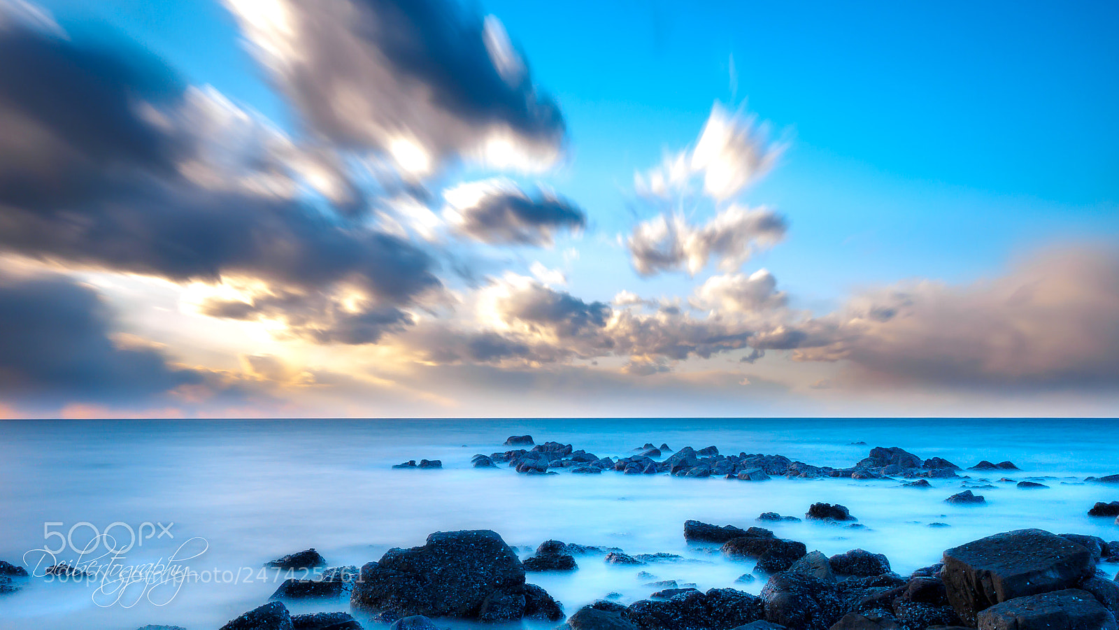 Olympus OM-D E-M1 sample photo. Clouds over ocean photography