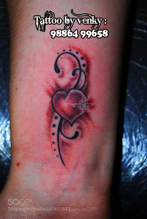 Nikon D60 sample photo. Tribal heart tattoo photography