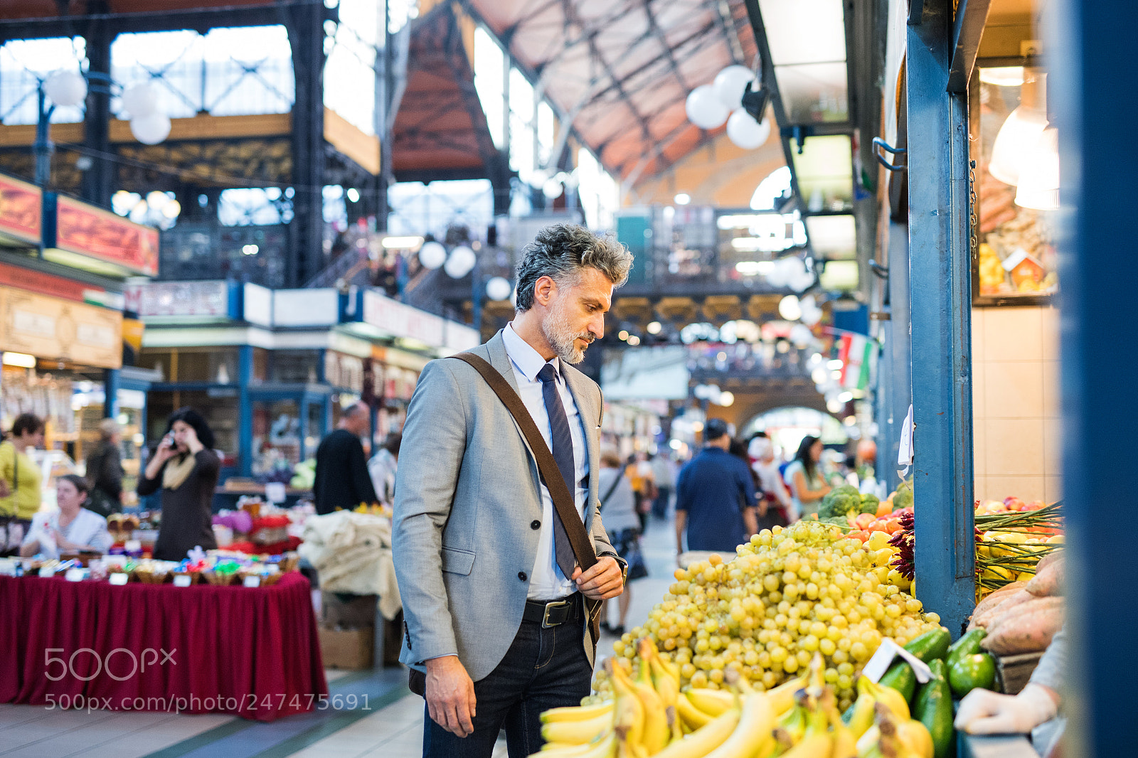 Nikon D5 sample photo. Mature businessman buying fruit photography