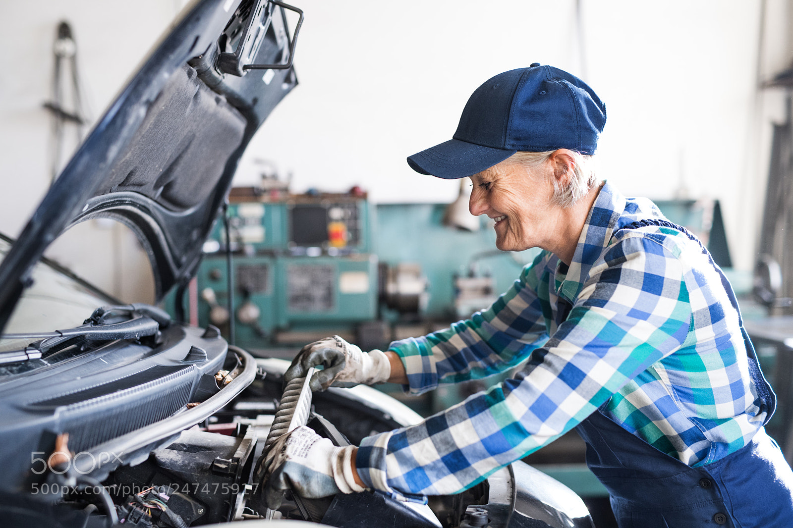 Nikon D5 sample photo. Senior female mechanic repairing photography