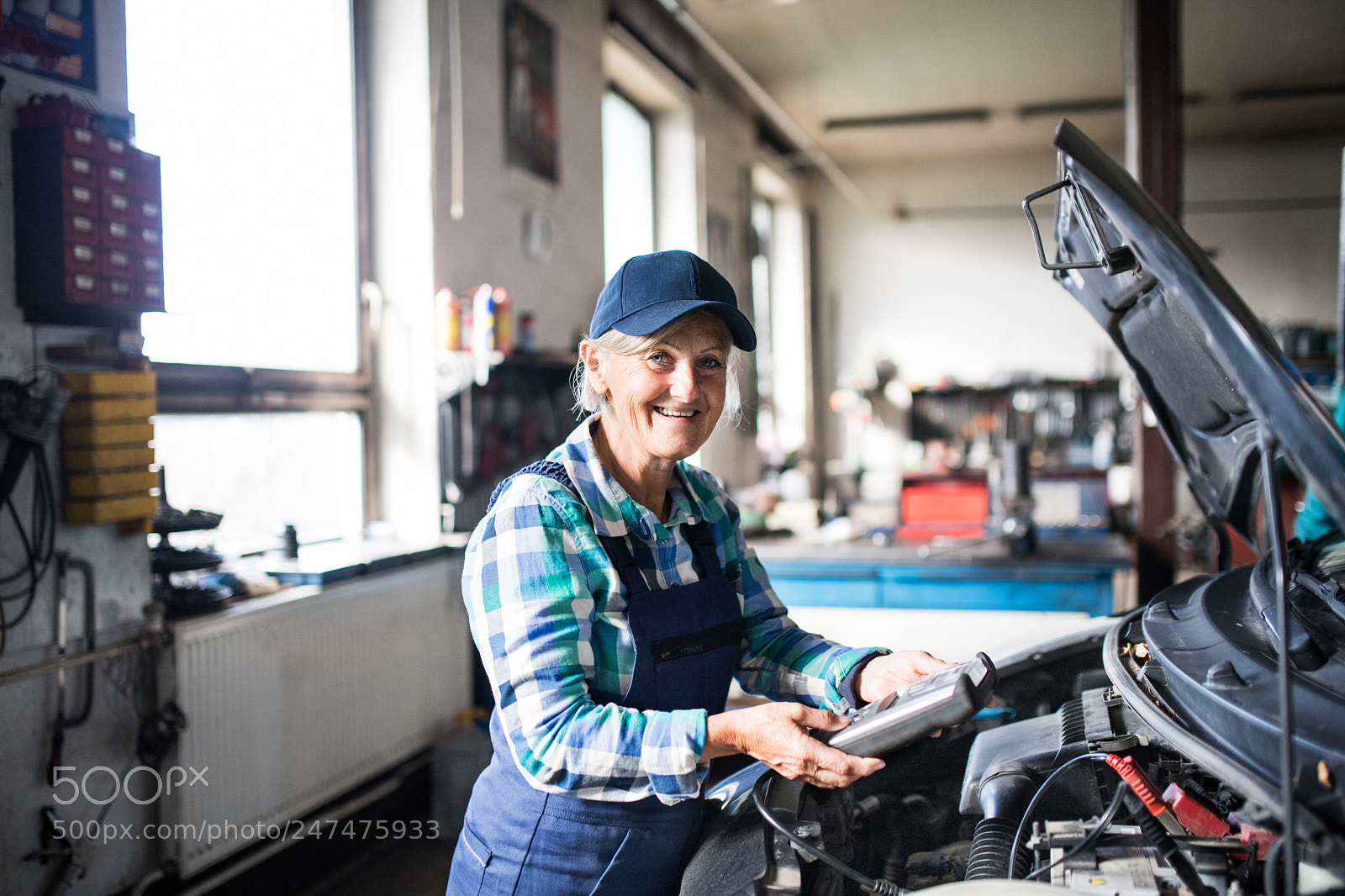 Nikon D5 sample photo. Senior female mechanic repairing photography