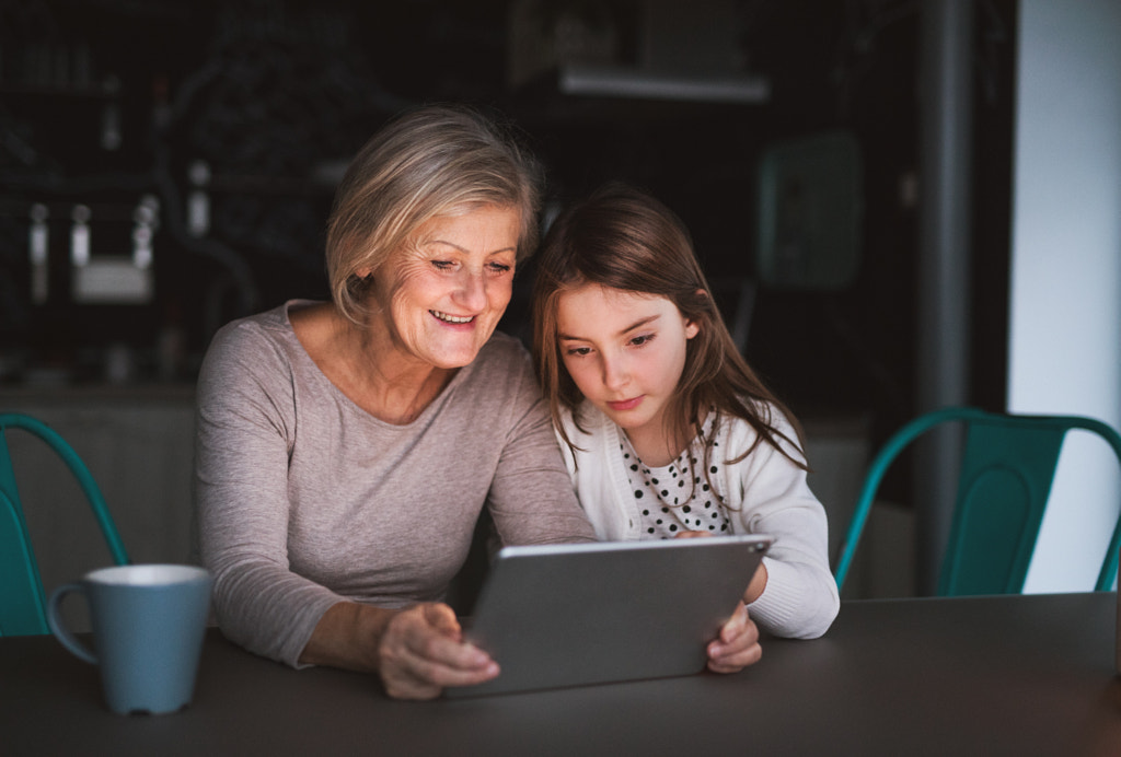 A small girl and grandmother with tablet at home. by Jozef Polc on 500px.com