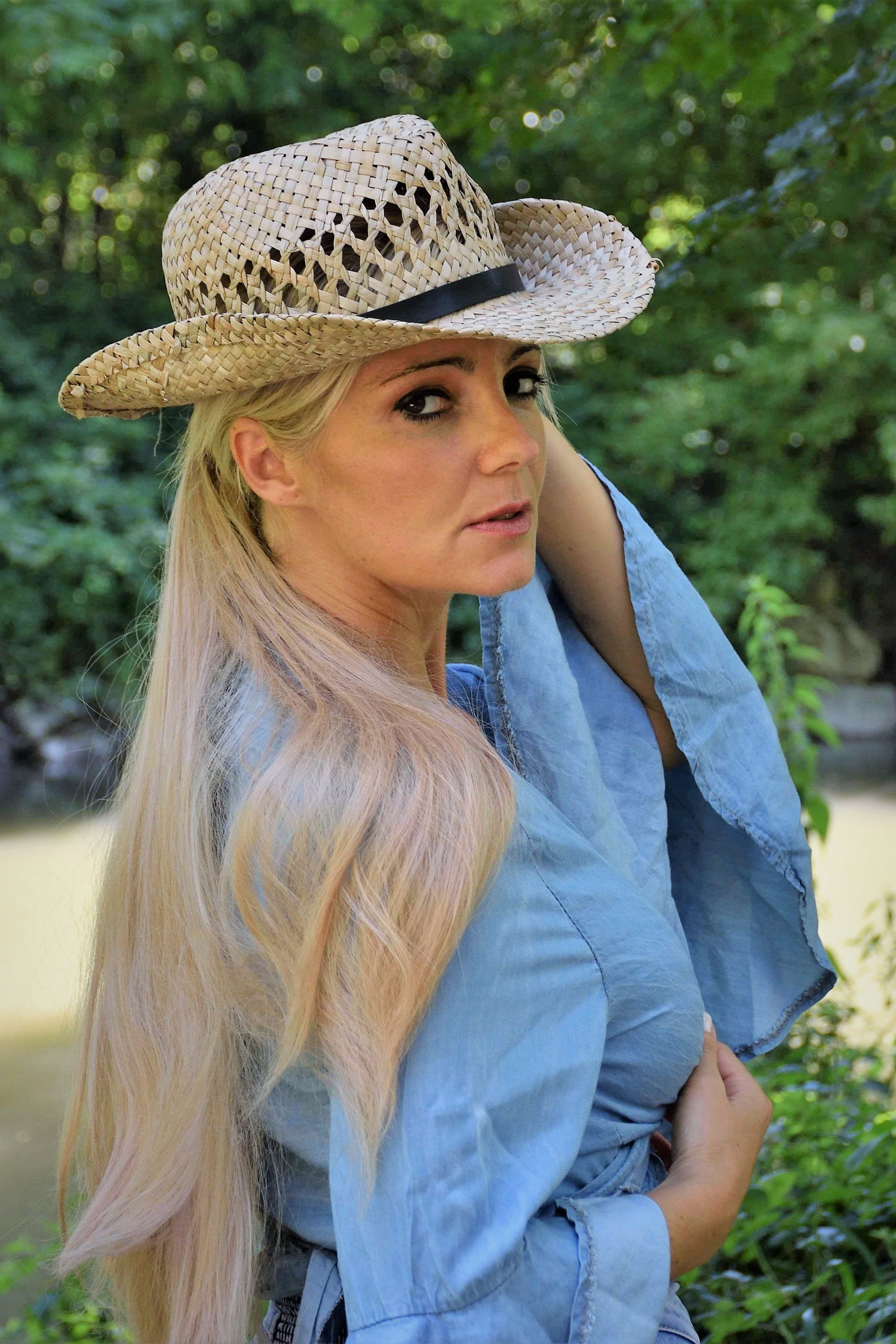Nikon D5500 sample photo. Sara playing with her hat photography