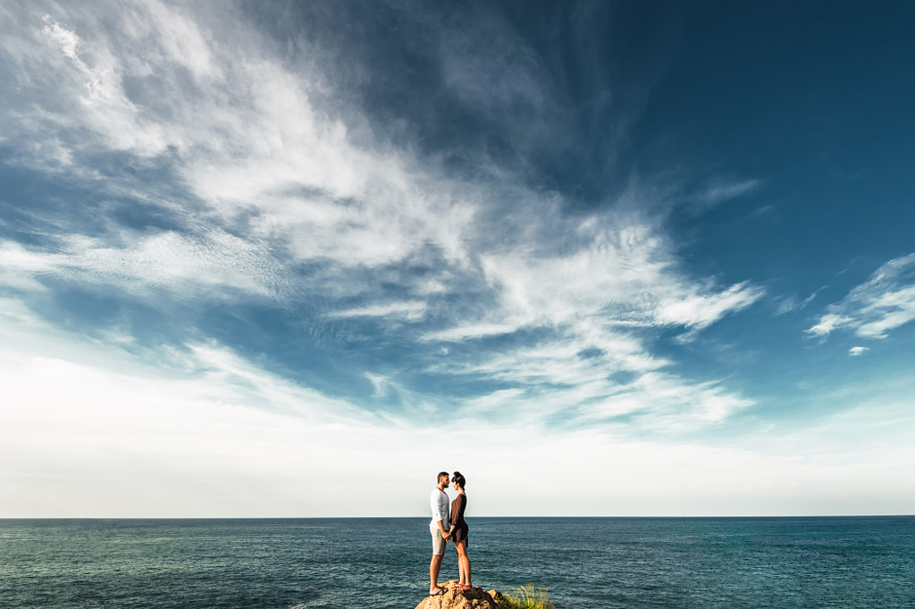 Couple poses - Lonely couple on a cliff by the sea by MISHA SOTNIKOV on 500px.com