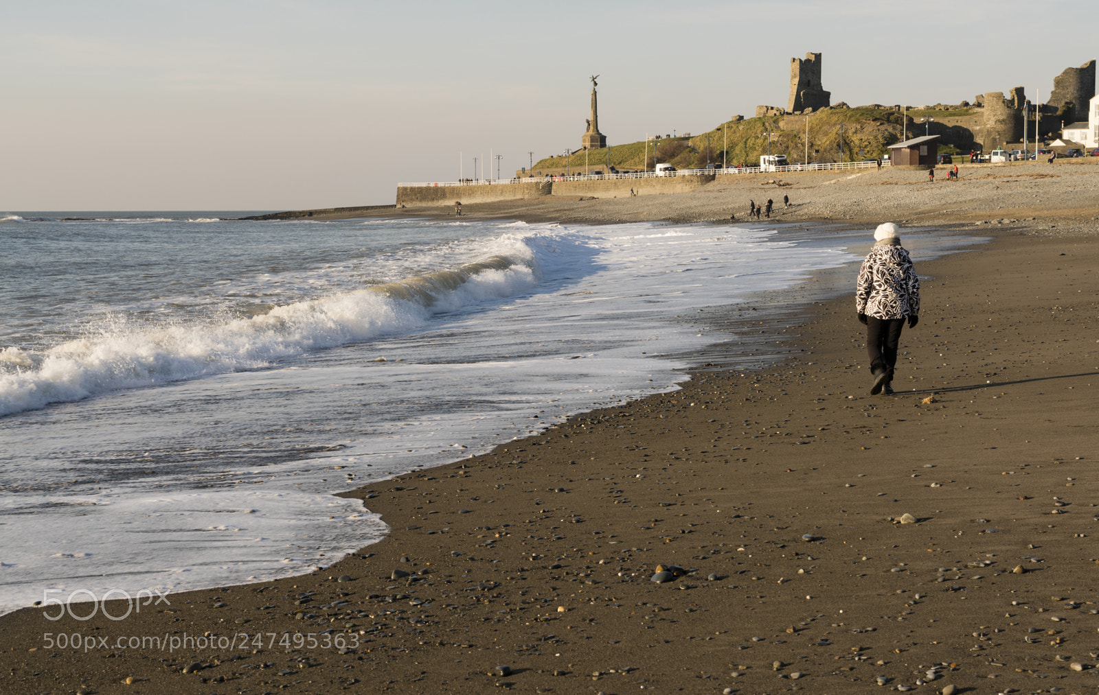 Sony a7R II sample photo. A woman wlaking along photography