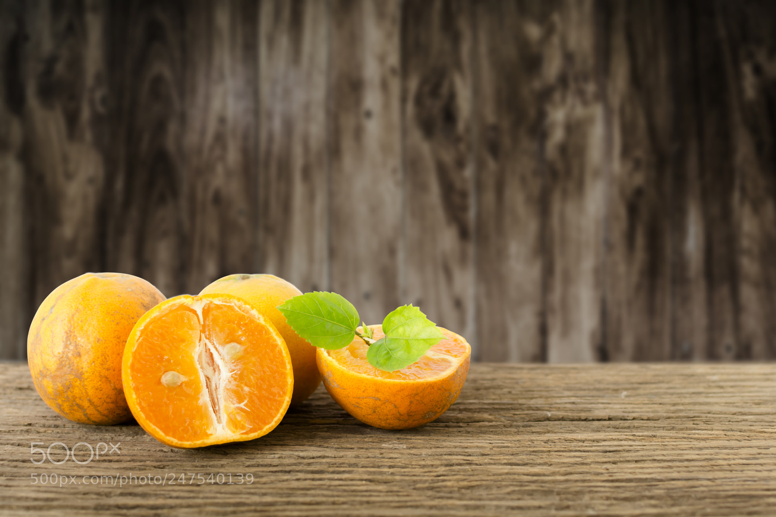 Nikon D5200 sample photo. Stack of orange fruit photography