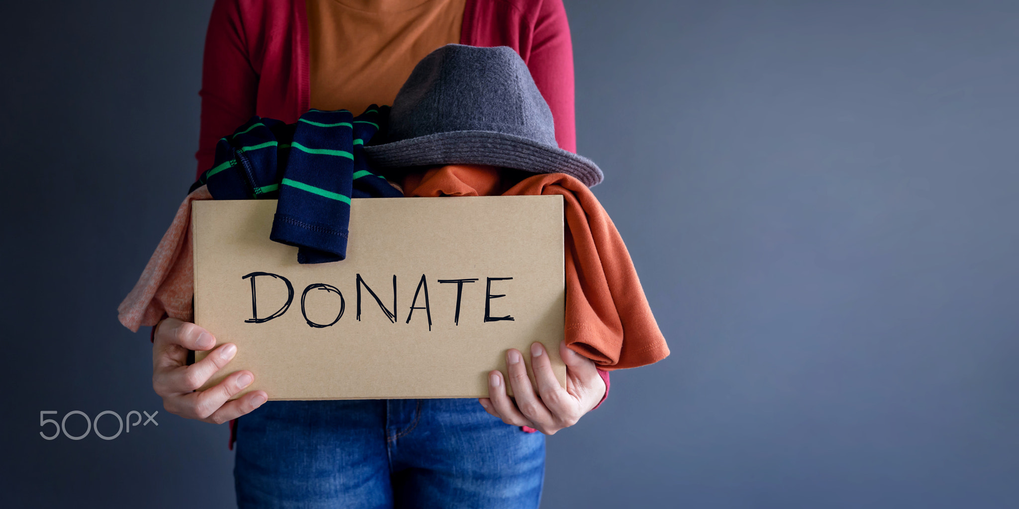 Donation Concept. Woman holding a Donate Box