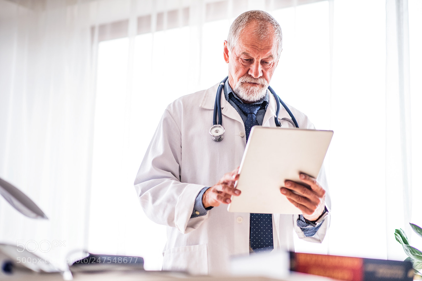 Nikon D5 sample photo. Senior doctor with tablet photography