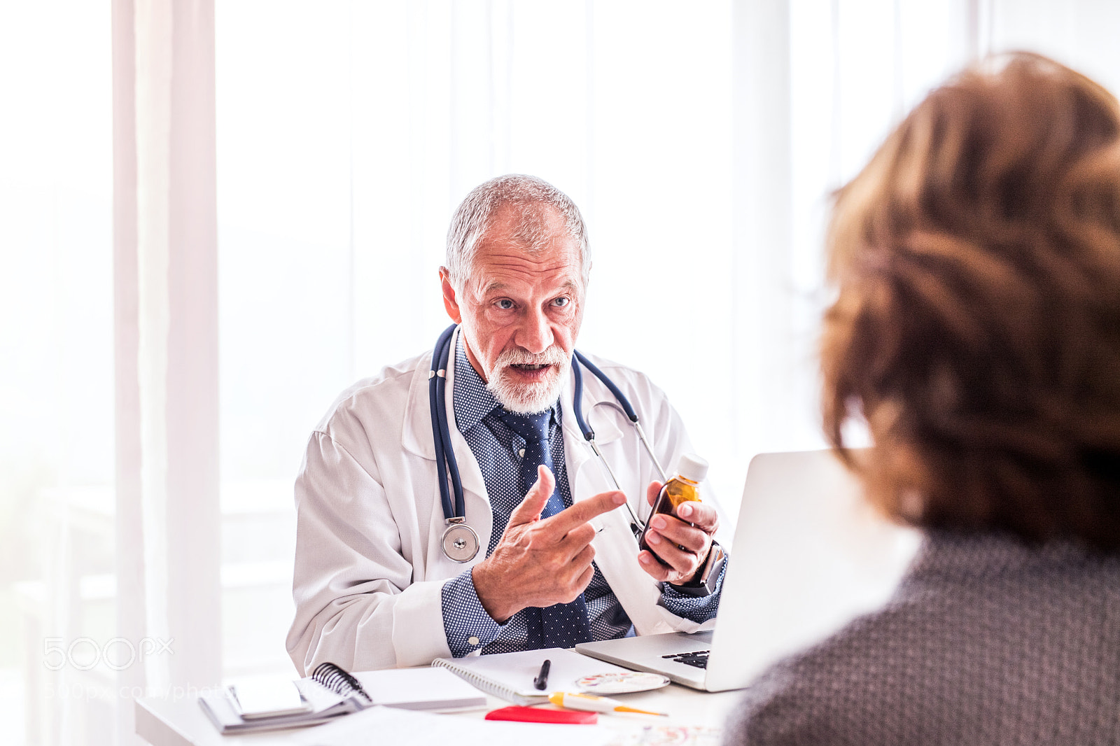 Nikon D5 sample photo. Doctor with laptop talking photography