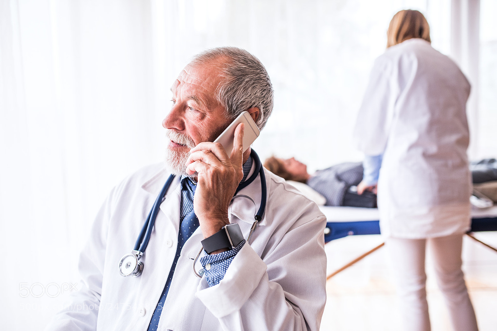 Nikon D5 sample photo. Senior doctor with smartphone photography