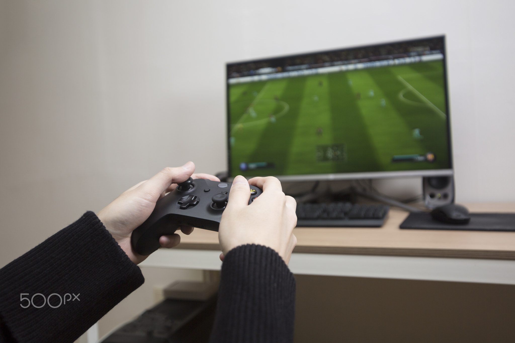 gamer playing pc game wearing headphone.