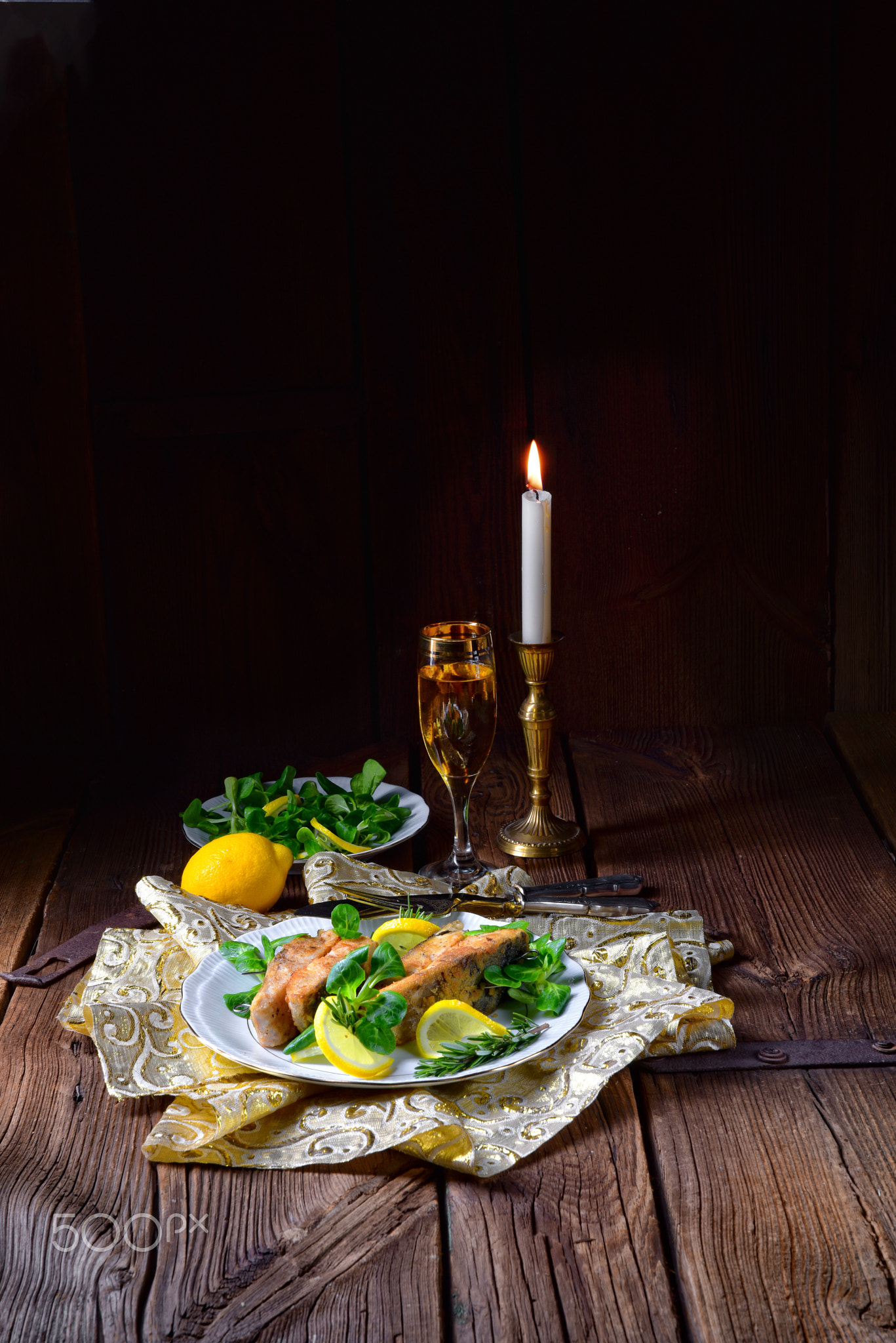 Fried carp fillet on wintry salad