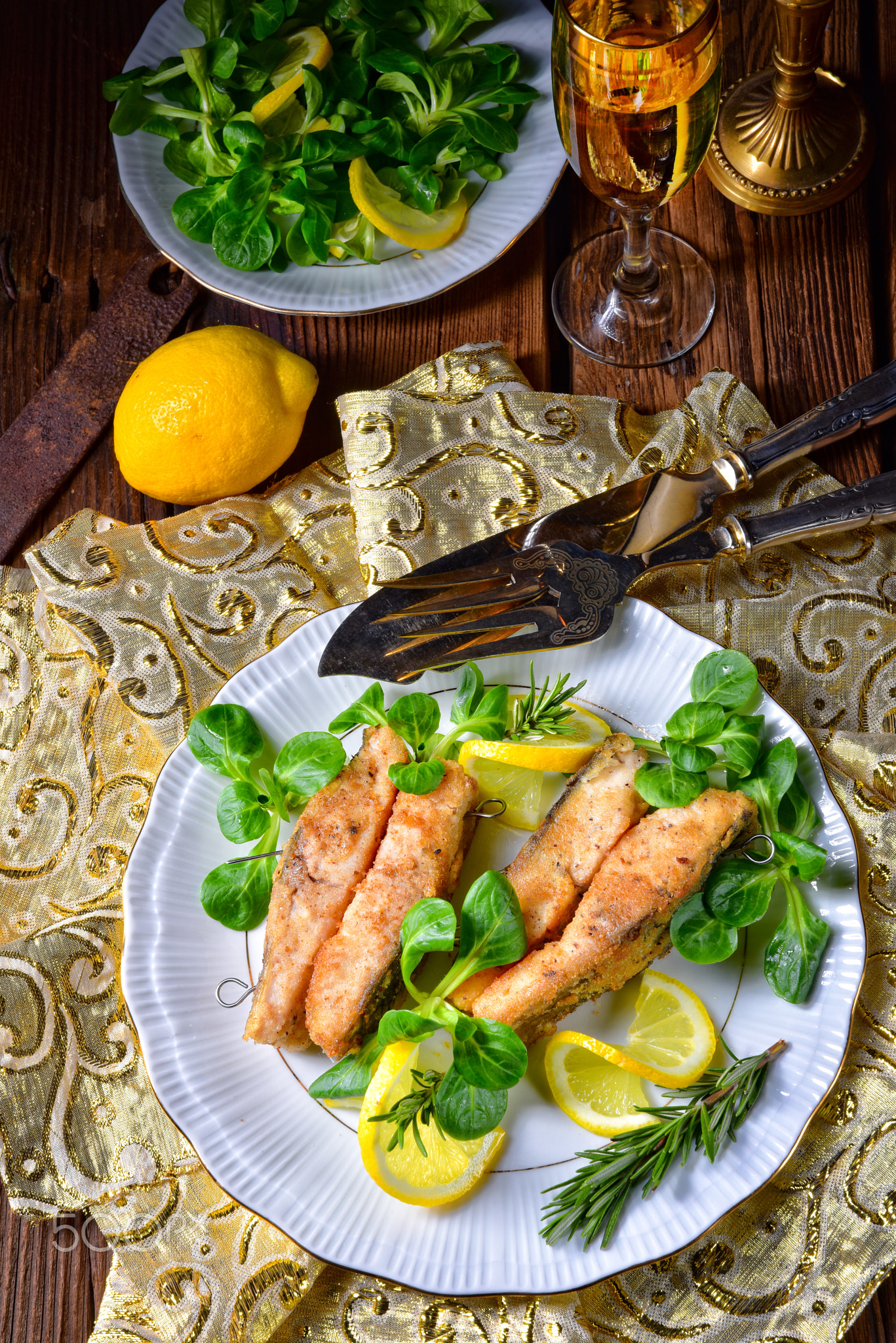 Fried carp fillet on wintry salad