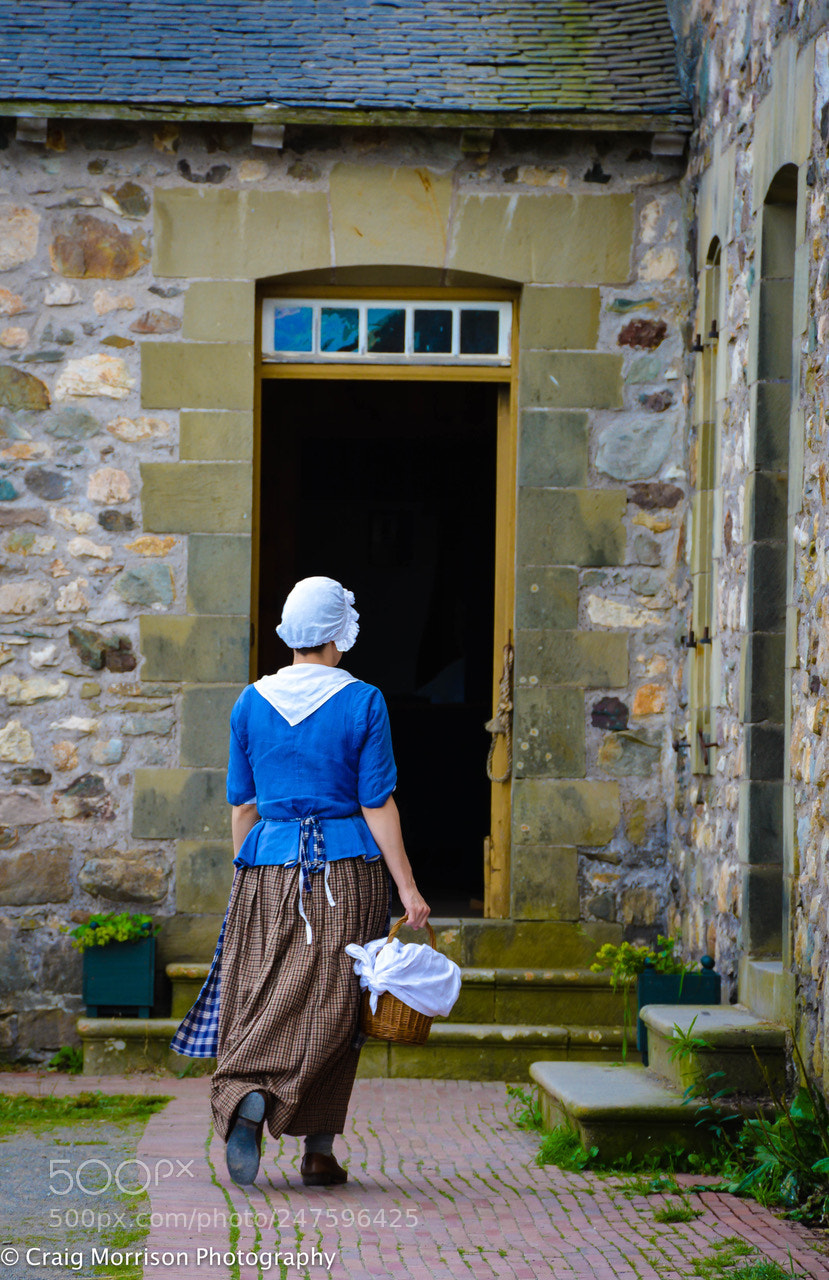 Nikon D7100 sample photo. A maid goes about photography