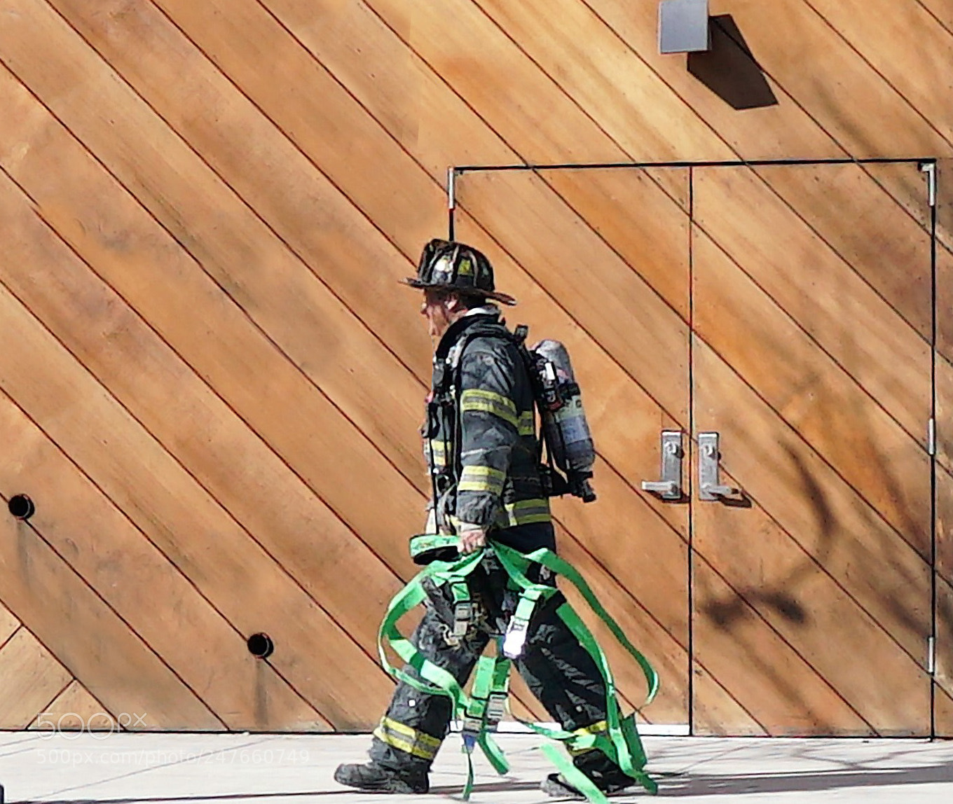 Sony a6500 sample photo. Firefighter returns to truck photography