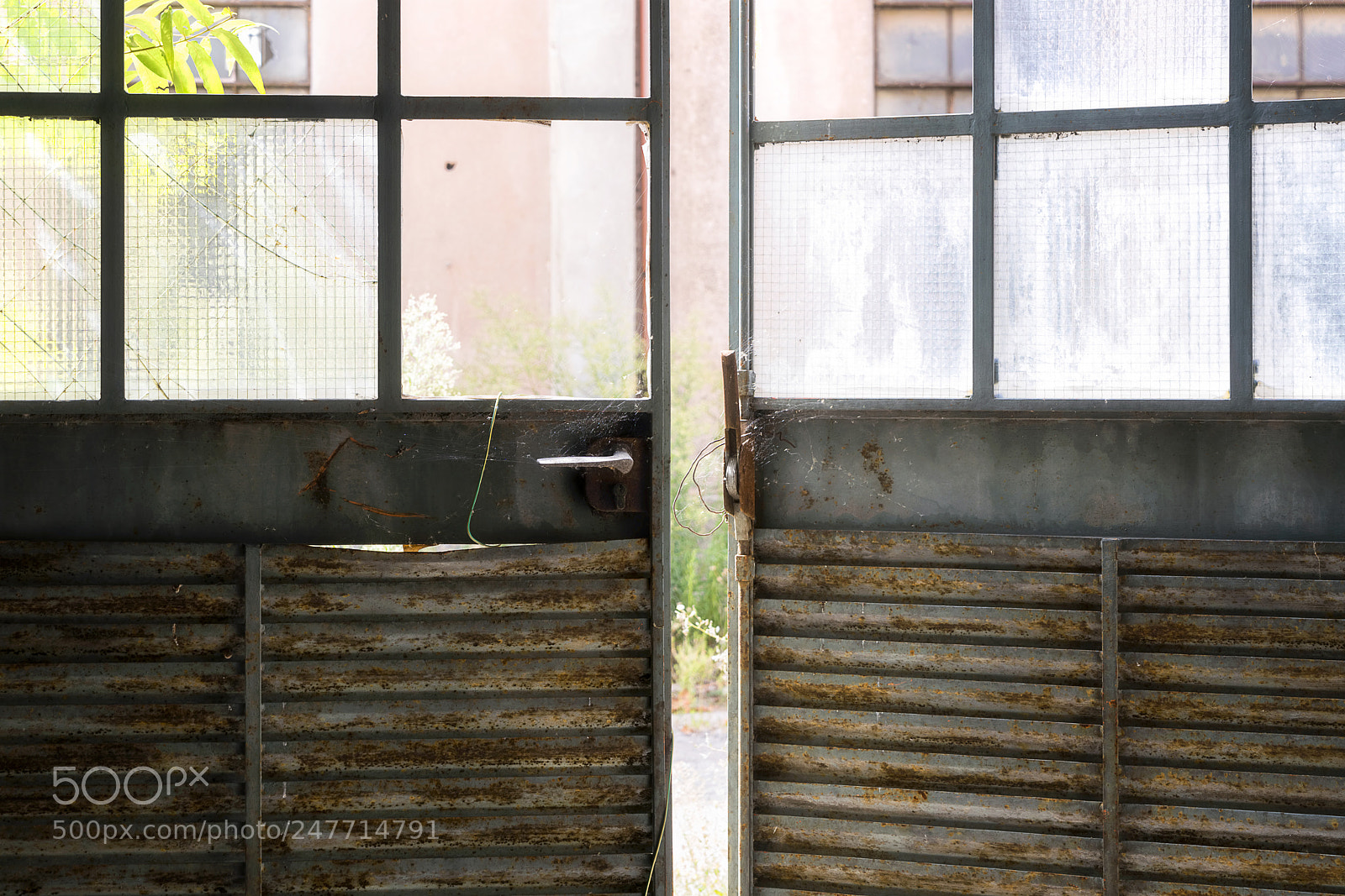Sony a7R II sample photo. Abandoned factory doors. photography