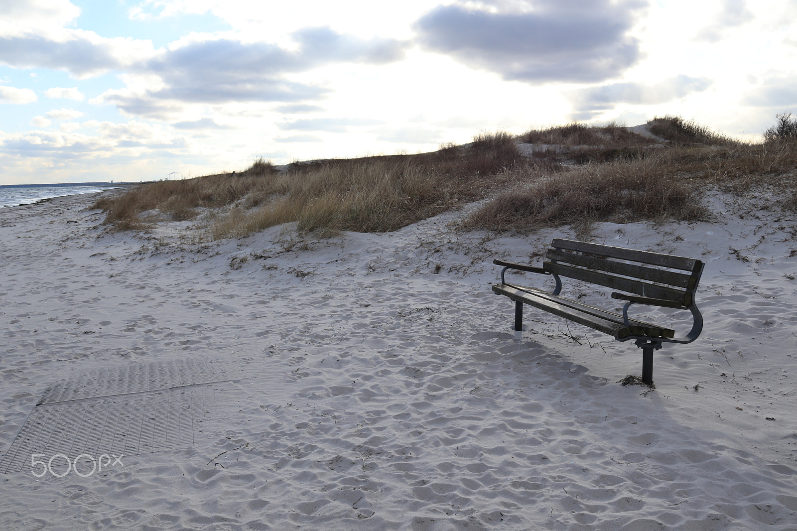 Canon EF-S 18-55mm F3.5-5.6 IS sample photo. Bench on beach photography