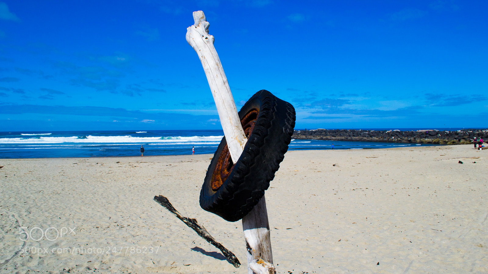 Nikon D3100 sample photo. Tire on beach photography
