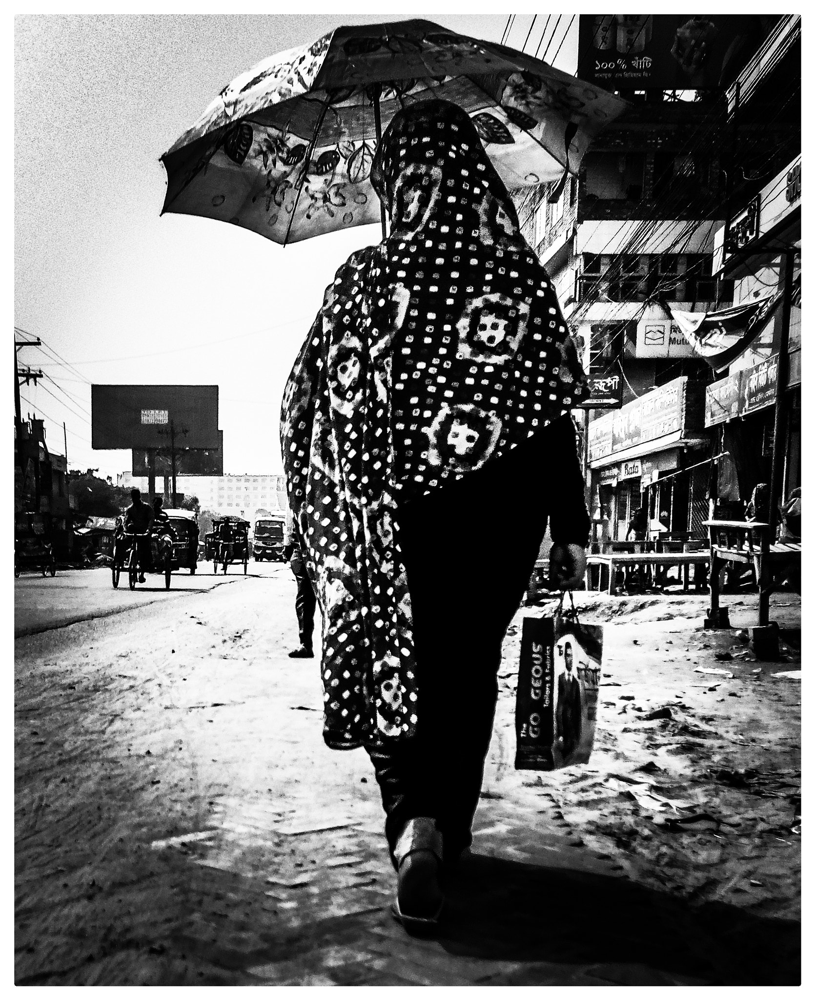 Symphony R100 sample photo. Woman walking in the street photography