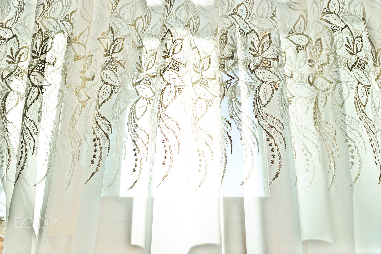Canon EOS M10 sample photo. Curtains with a pattern in the hall illuminated by sunshine photography
