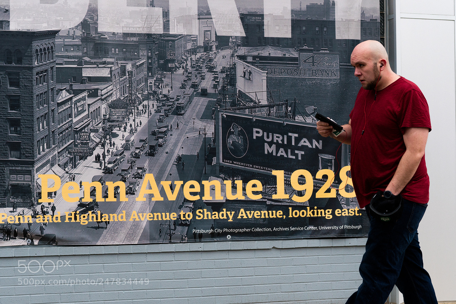 Sony a6500 sample photo. Man walking next to photography