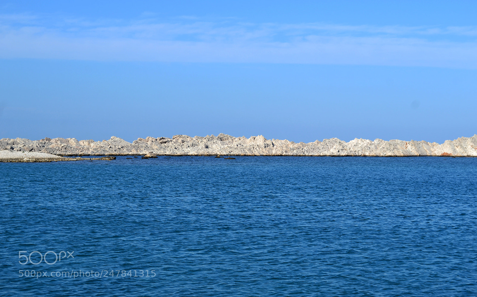 Nikon D3100 sample photo. Blue sea white rocks photography