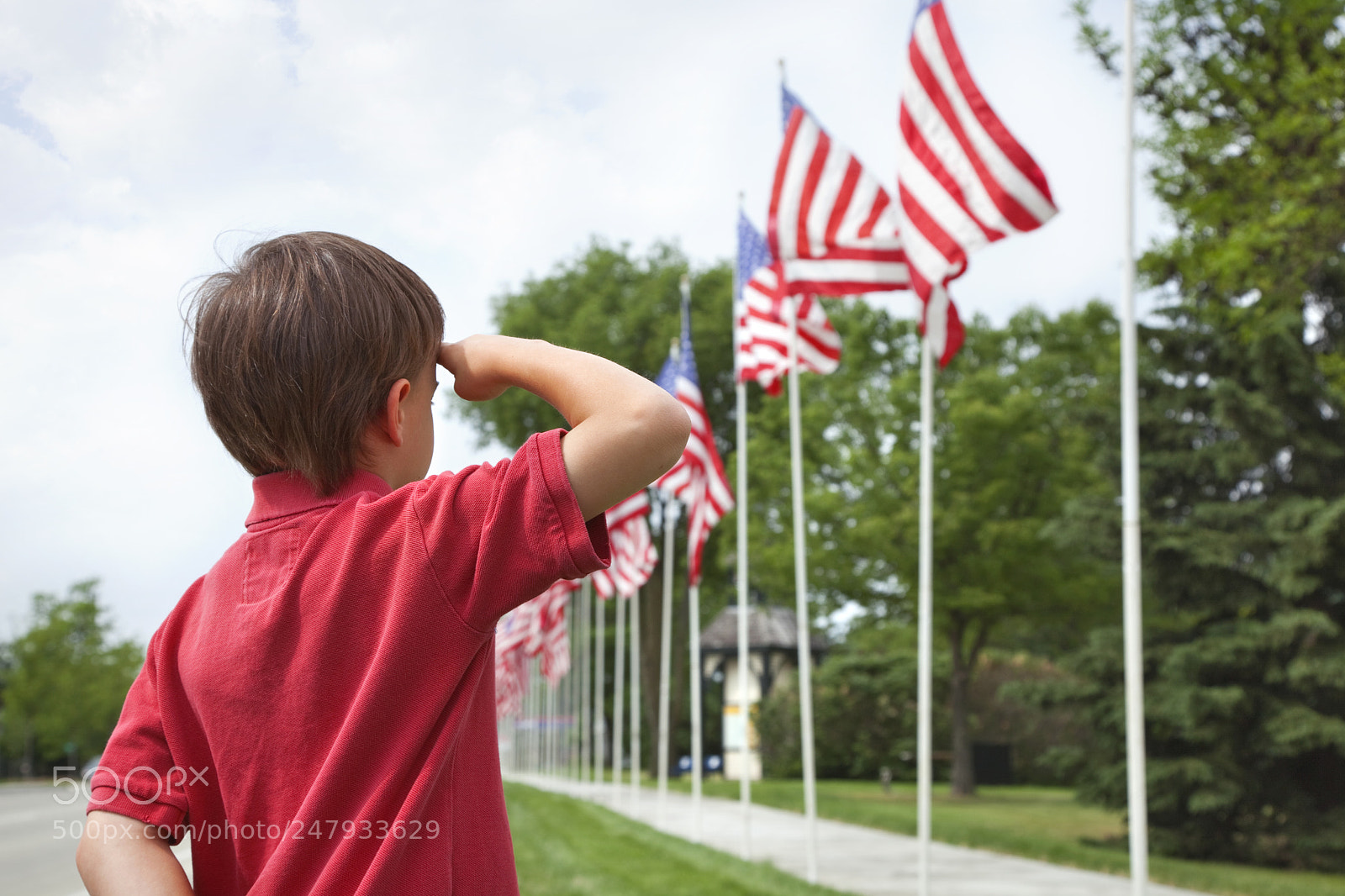 Canon EOS 5D Mark II sample photo. Boy salutes flags at photography