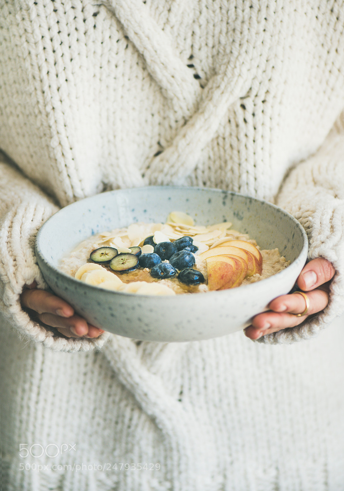 Nikon D610 sample photo. Woman in sweater holding photography