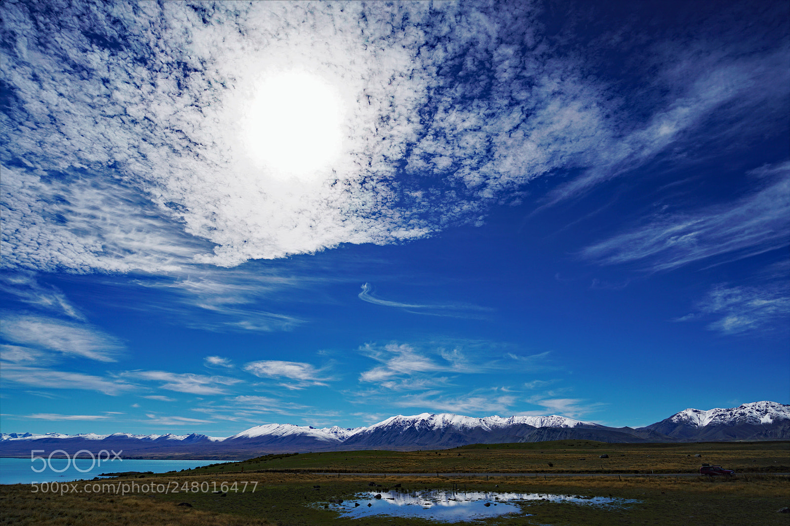 Sony a7R II sample photo. Sun behind cloud photography