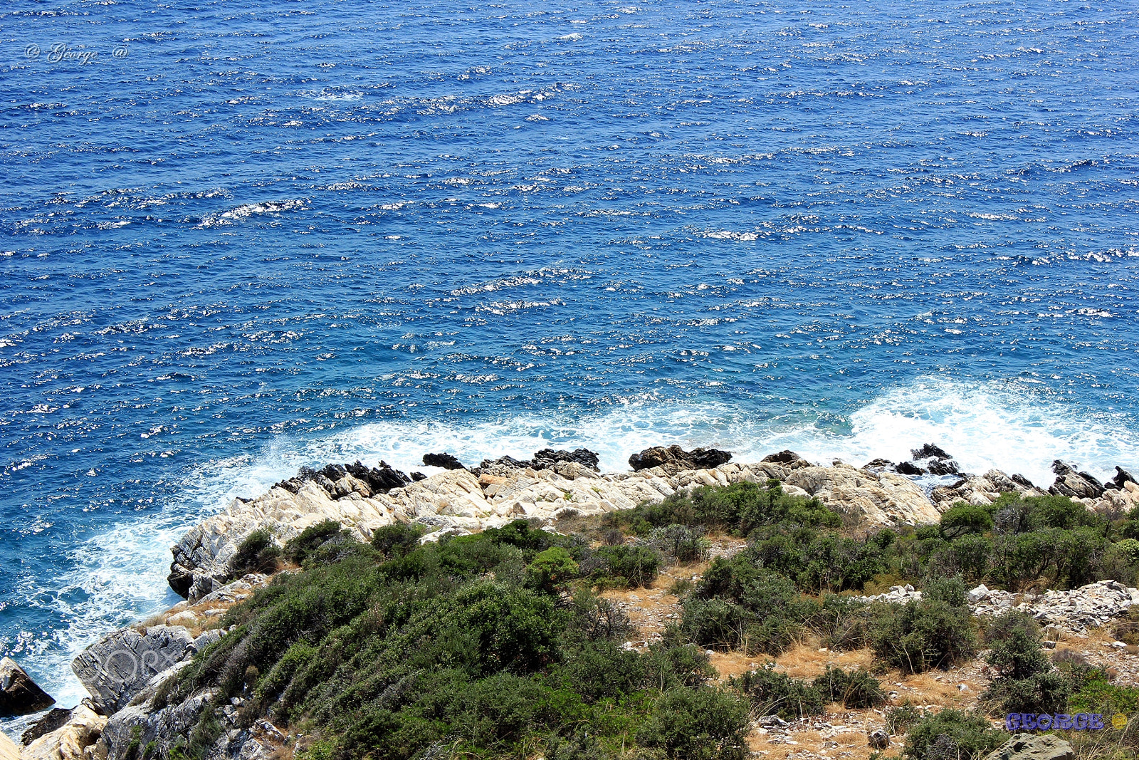 Canon EOS 550D (EOS Rebel T2i / EOS Kiss X4) sample photo. Think blue  - waves crashing on rocks photography