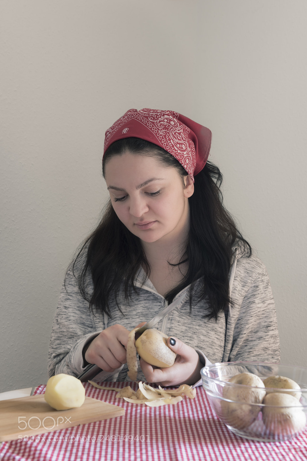 Nikon D750 sample photo. Brunette woman peeling potatoes photography