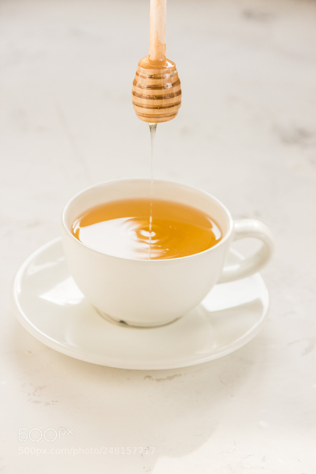 Canon EOS 600D (Rebel EOS T3i / EOS Kiss X5) sample photo. Honey pouring from stick photography