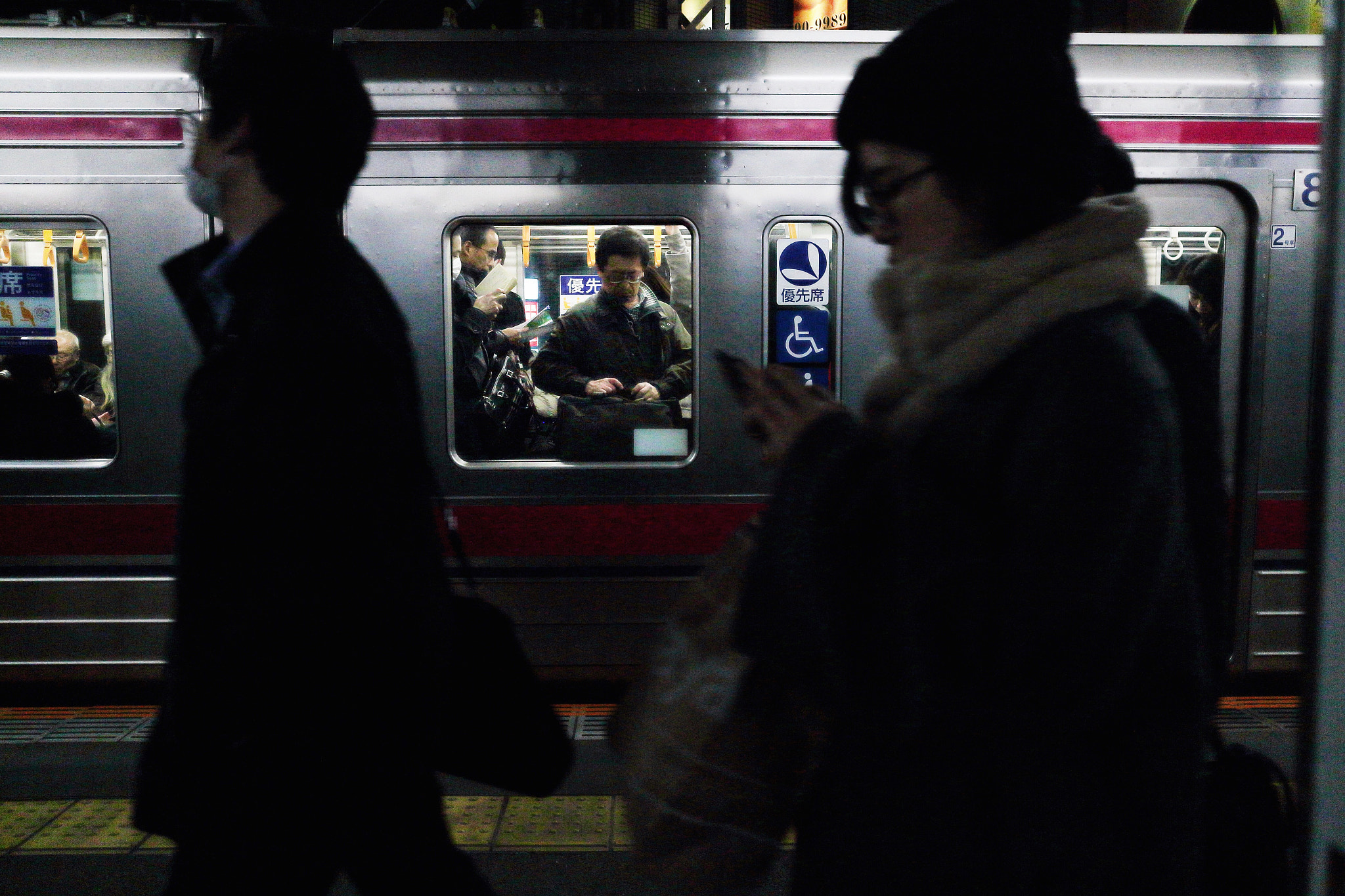Canon EOS M2 sample photo. Men in the train photography