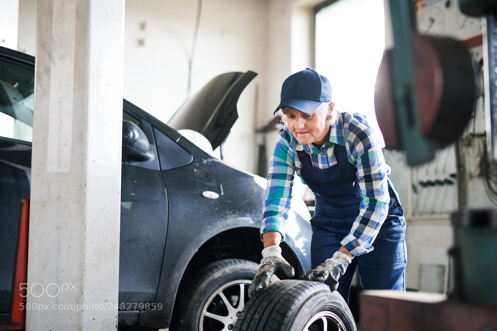 Nikon D5 sample photo. Senior female mechanic repairing photography