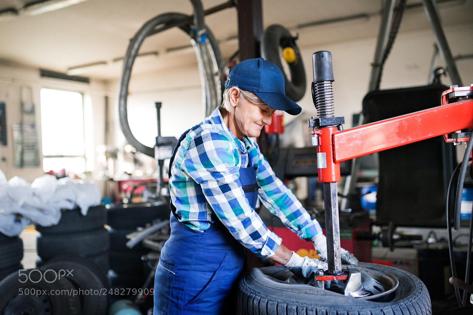 Nikon D5 sample photo. Senior female mechanic repairing photography