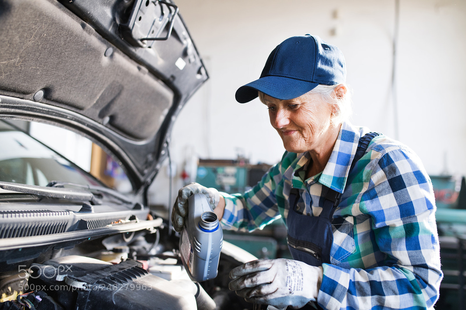 Nikon D5 sample photo. Senior female mechanic repairing photography