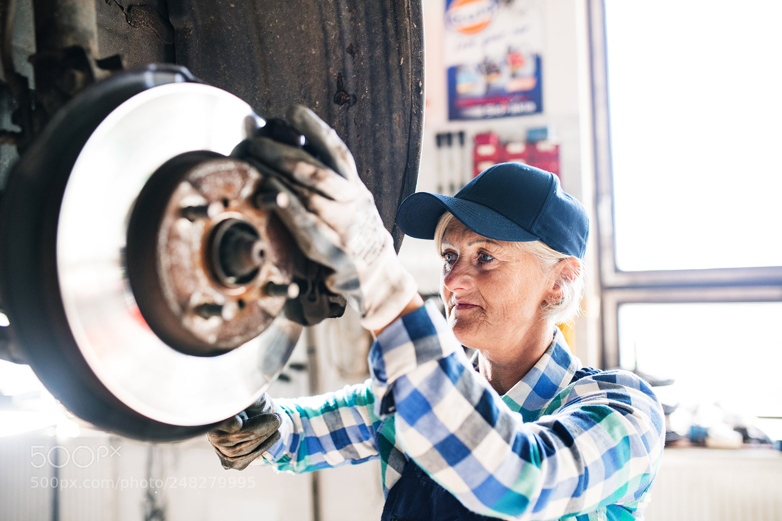 Nikon D5 sample photo. Senior female mechanic repairing photography
