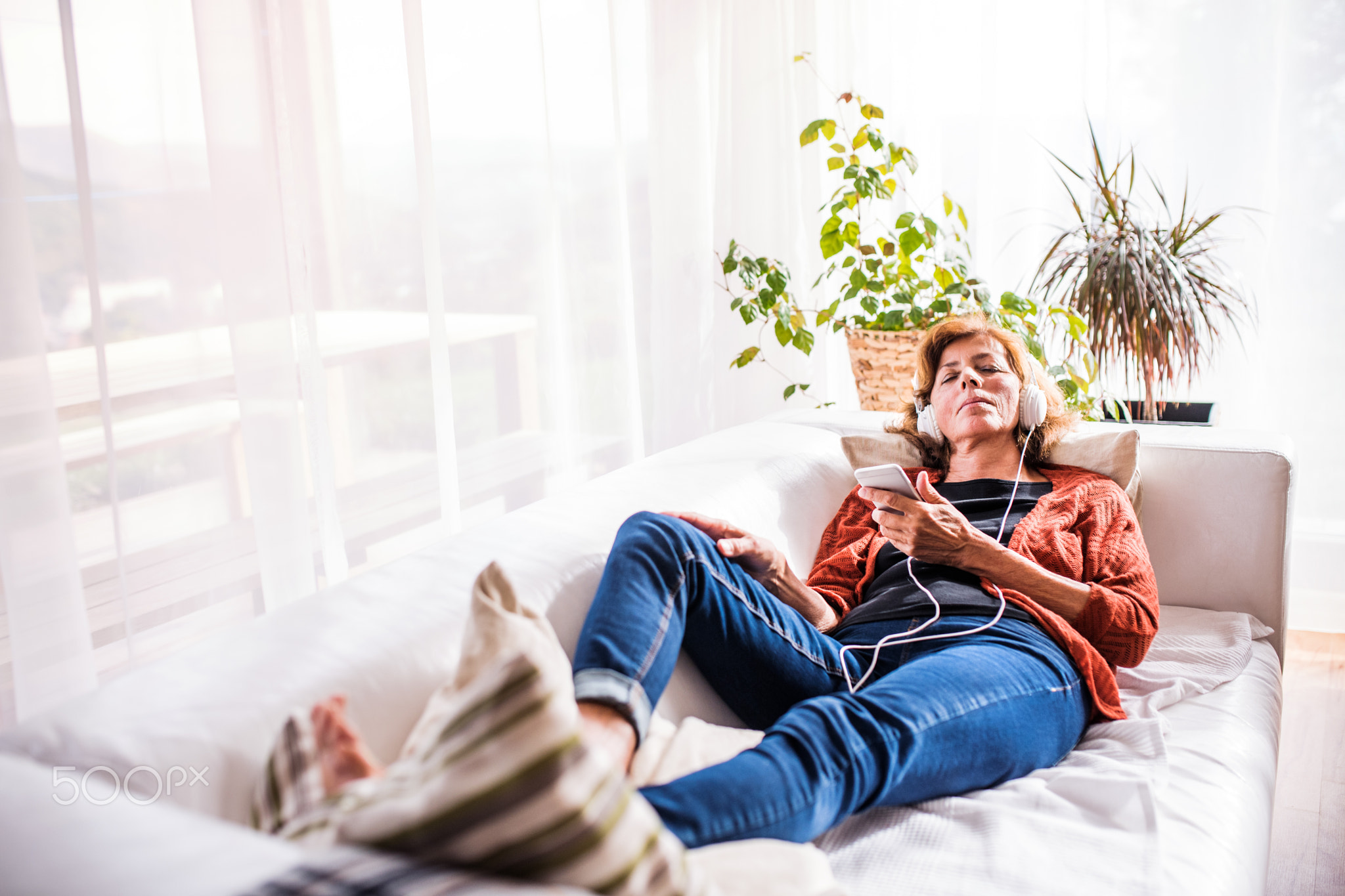 Senior woman relaxing at home.