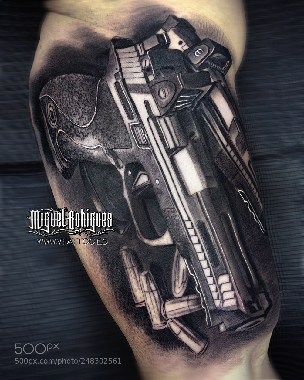Apple iPhone X sample photo. Gun tattoo photography