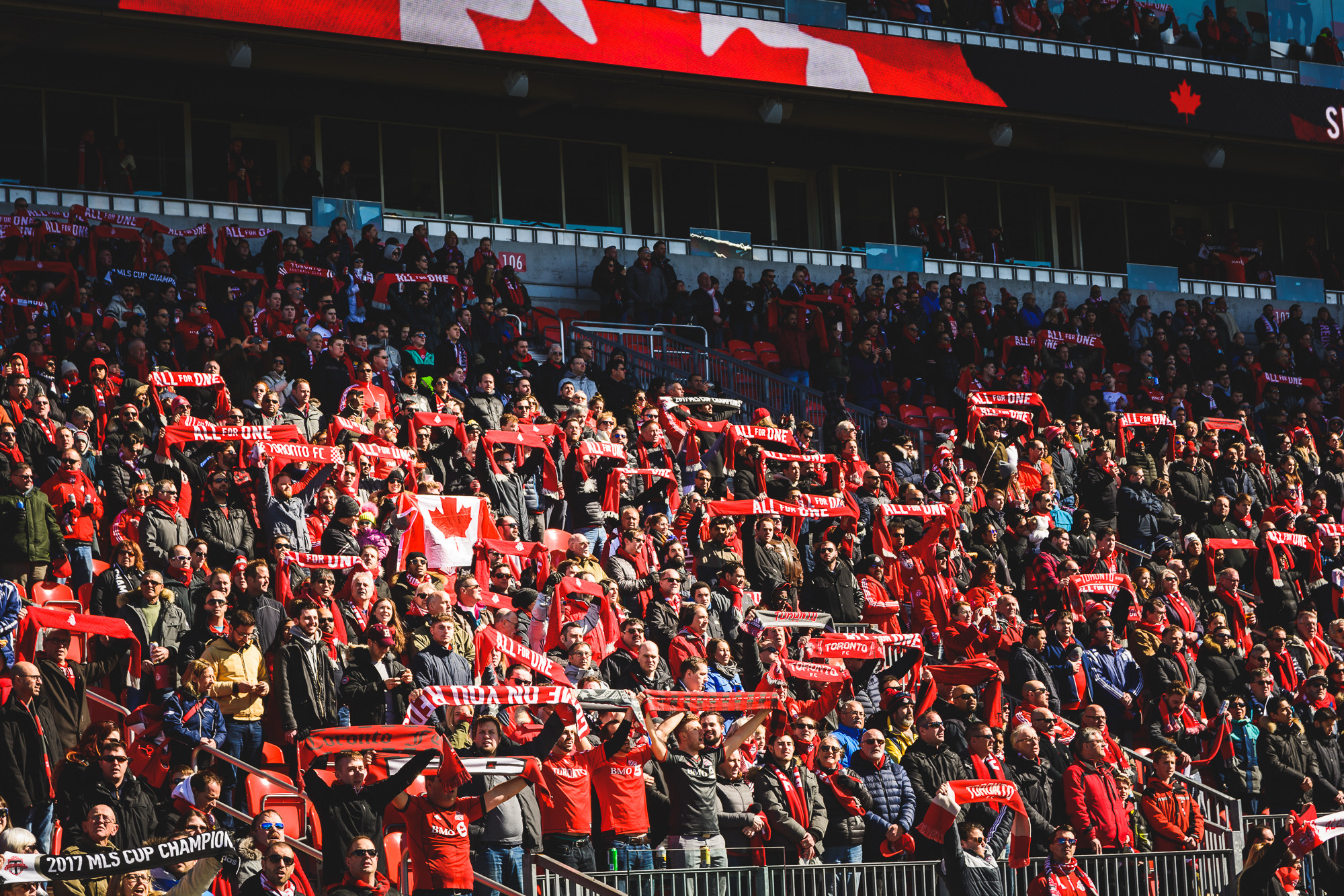 Toronto FC fans raise their scarves during national anthem.