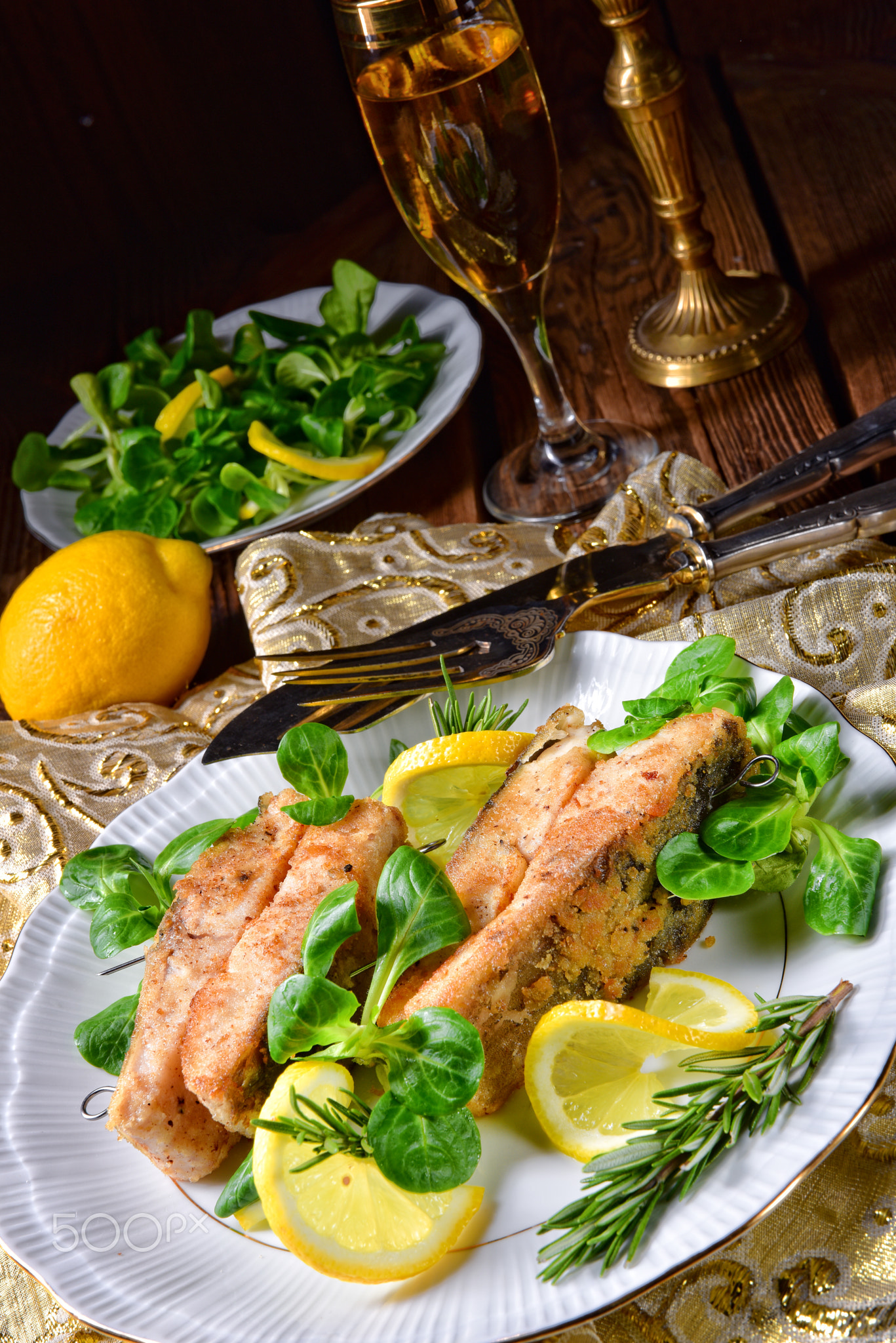 Fried carp fillet on wintry salad