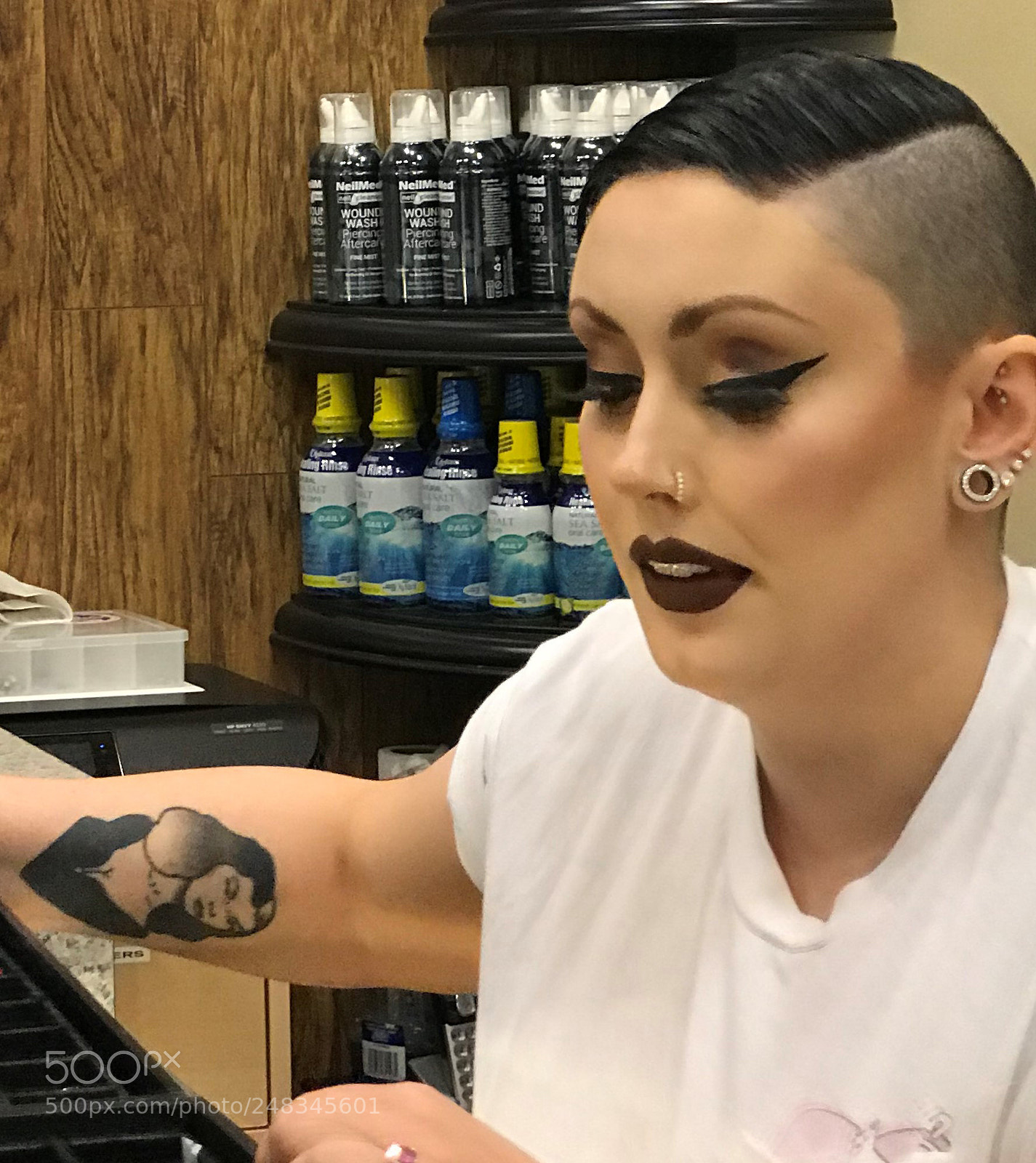 Apple iPhone 7 Plus sample photo. Worker at a tattoo photography