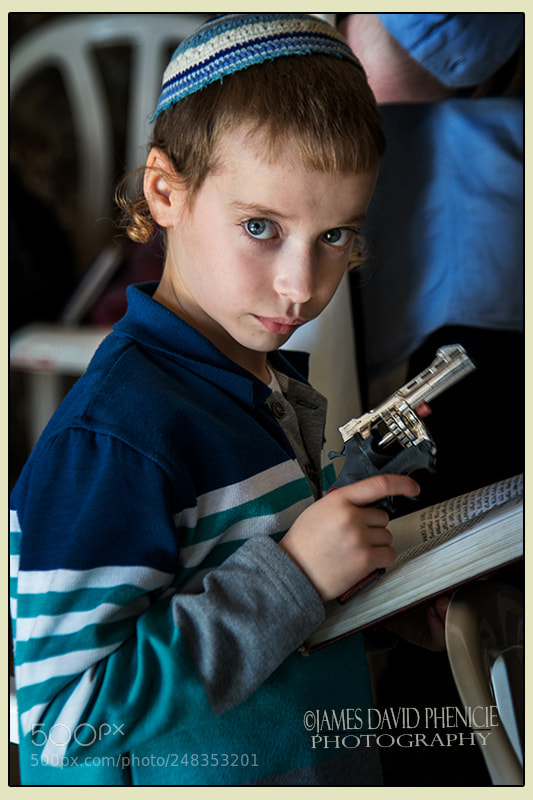 Nikon D500 sample photo. Praying and a gun photography