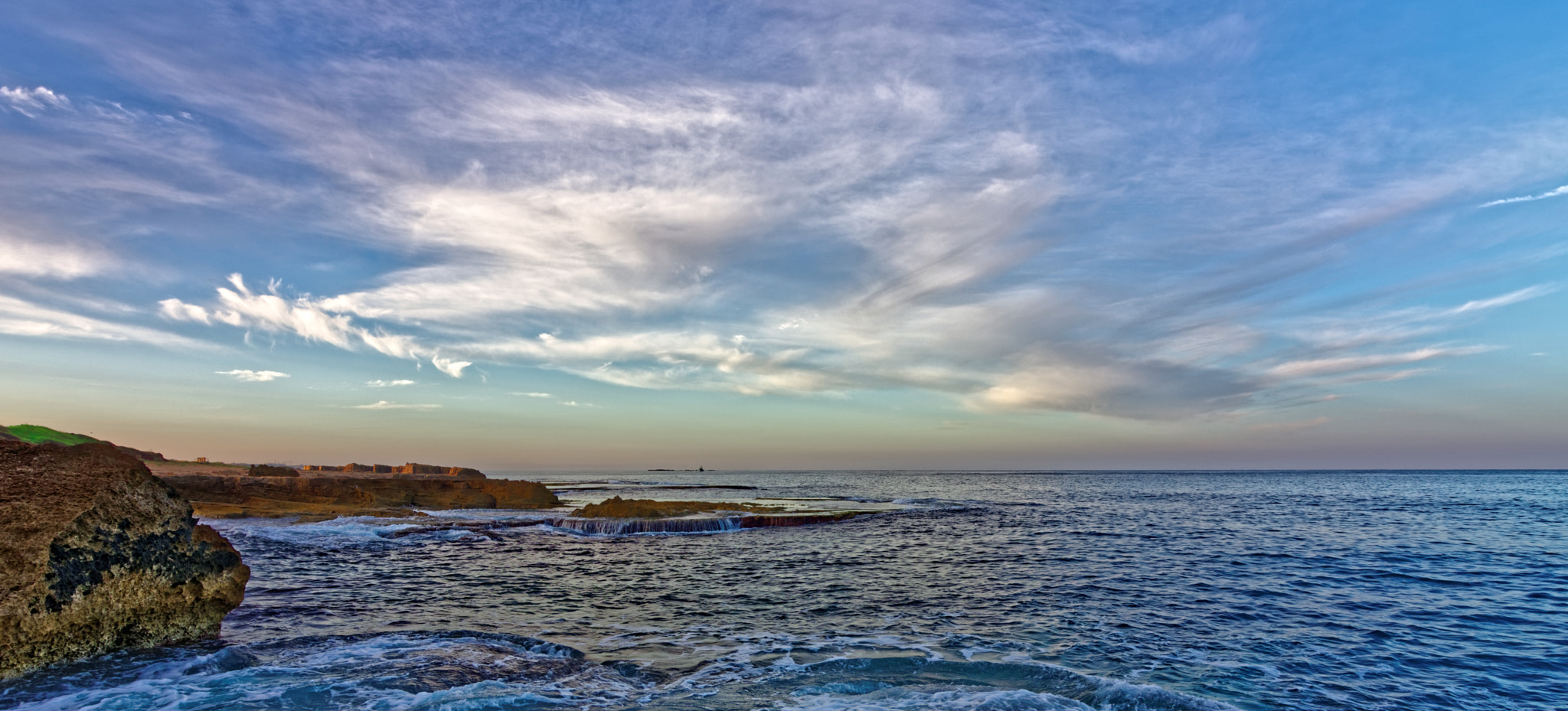 Nikon D7200 sample photo. Landscape of rocky shoreline with tranquil waves o photography