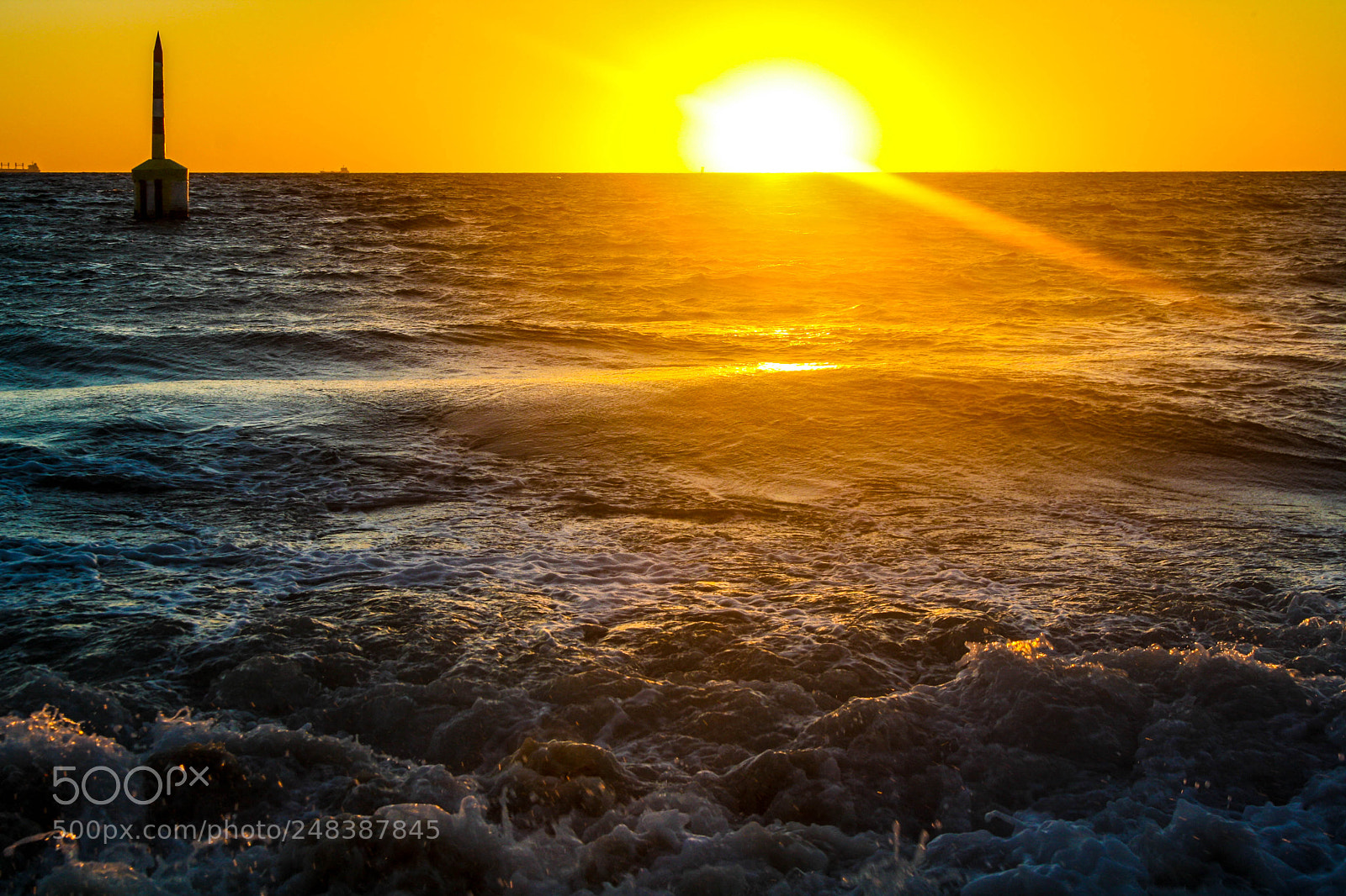 Canon EOS 1000D (EOS Digital Rebel XS / EOS Kiss F) sample photo. Sunset over breaking waves photography