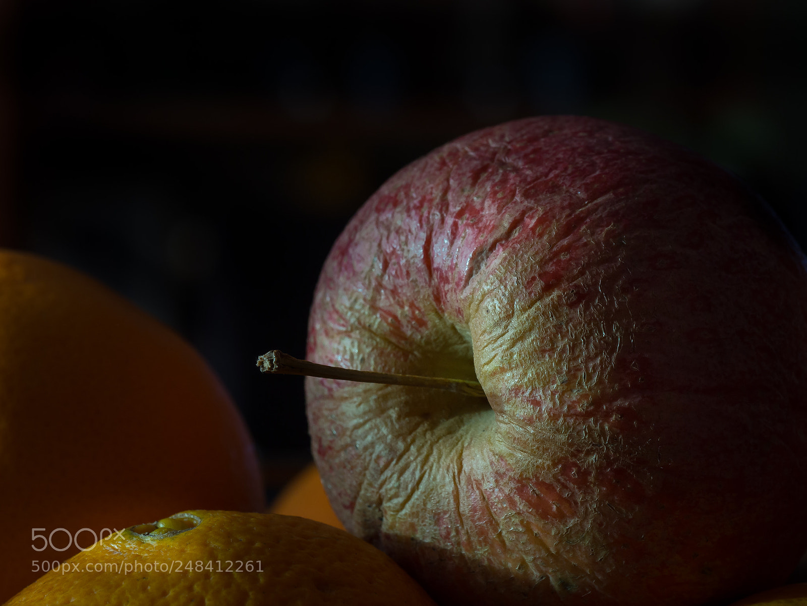 Olympus OM-D E-M10 sample photo. Old apple on orange photography