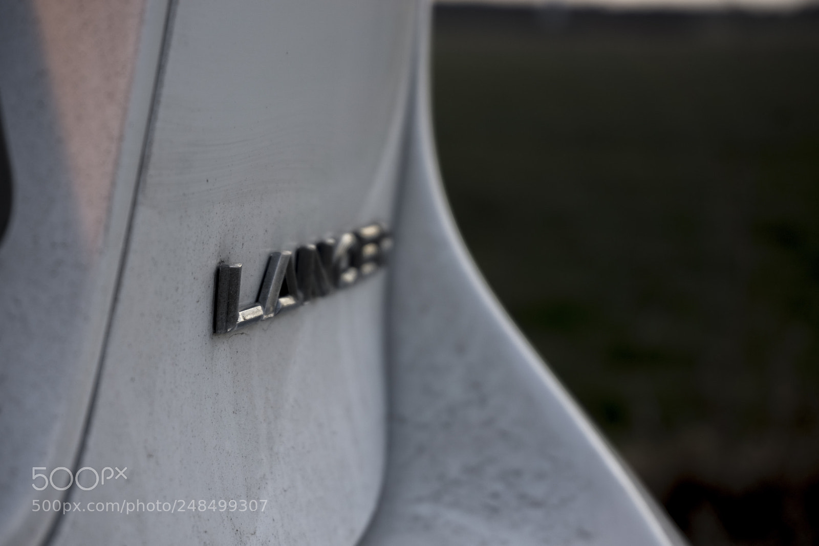 Sony a6000 sample photo. Dirty lancer logo photography